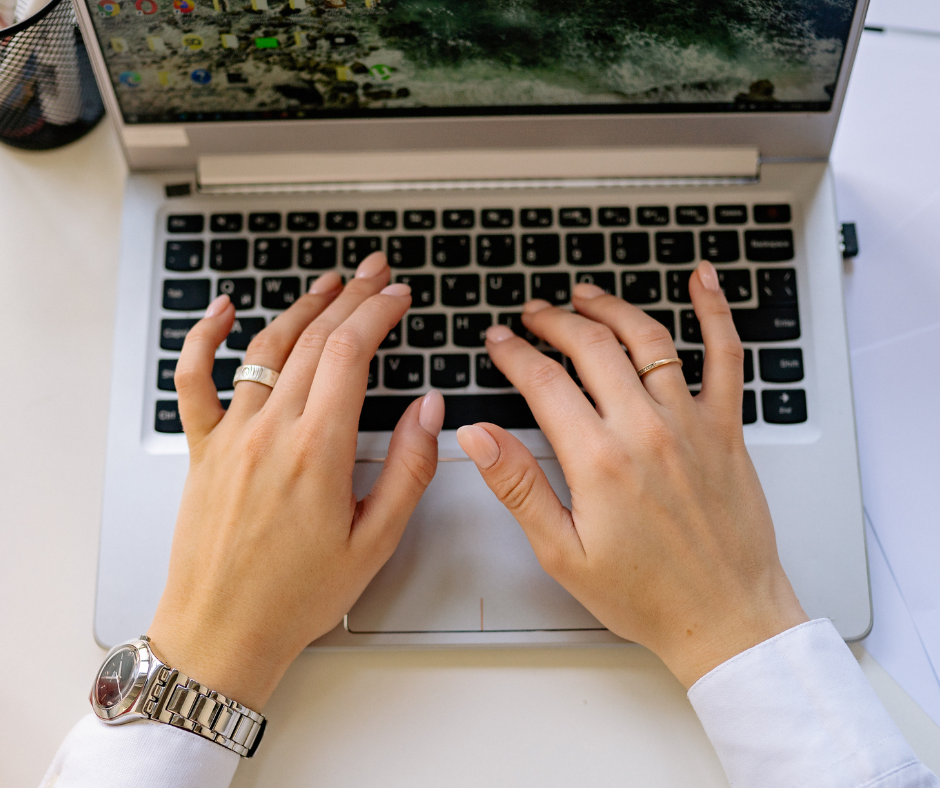 Hands typing on laptop for ping post workflow